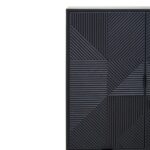 Tall black wooden cabinet with carved abstract pattern, metal legs, and concealed interior shelving for versatile storage.
