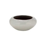 Low-profile off-white ceramic planter with wide opening and drainage hole, ideal for modern indoor or outdoor spaces.
