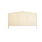 White carved wooden bed with upholstered buttoned panels, featuring a rustic weathered finish and bohemian French-inspired design.