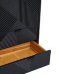 Tall black wooden cabinet with carved abstract pattern, metal legs, and concealed interior shelving for versatile storage.