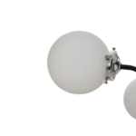 Modern pendant light with 16 black arms, chrome-finish center, and white glass globe shades, ideal for large contemporary interiors.