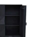 Tall black wooden cabinet with carved abstract pattern, metal legs, and concealed interior shelving for versatile storage.