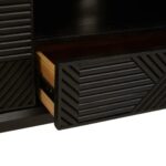 Black carved wood TV/media unit with slim black metal legs, featuring ample storage and wide top surface for large televisions.