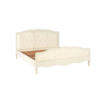 White carved wooden bed with upholstered buttoned panels, featuring a rustic weathered finish and bohemian French-inspired design.