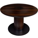 JOBURG 120 Dining Table with round smoked eucalyptus top and black cylindrical base – modern pedestal dining table Ø120 cm x 76 cm for elegant interiors.