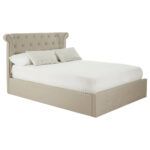 ELLI Beige Ottoman Double Bed with winged headboard, rolled edges, tufted detailing, and muted beige linen upholstery, combining luxe contemporary style with ottoman storage.