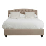 LAYA Mink Double Bed with brushed velvet upholstery, diamond-tufted arched headboard, metallic button detailing, and black orb feet.