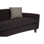 RANIA three-seat black sofa with sweeping low-profile backrest, arcing arms, single curved cushion, and chevron-patterned dimity fabric upholstery on pine wood legs