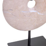 NAVIS Beige Marble Sculpture – polished cream marble disc with natural veining on black metal stand.