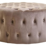 The LUCRA Mink Velvet Footstool features plush velvet upholstery, button tufting, and foam padding. A versatile round ottoman for luxe, modern, or classic interiors.