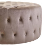 The LUCRA Mink Velvet Footstool features plush velvet upholstery, button tufting, and foam padding. A versatile round ottoman for luxe, modern, or classic interiors.