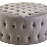 LUCRA Grey Velvet Footstool – round grey velvet footstool with button tufting and foam padding.
