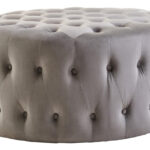 LUCRA Grey Velvet Footstool – round grey velvet footstool with button tufting and foam padding.