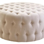 LUCRA Beige Velvet Footstool – round beige velvet footstool with button tufting and foam padding.