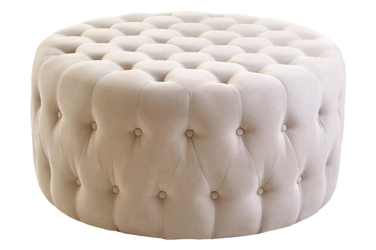 LUCRA Beige Velvet Footstool – round beige velvet footstool with button tufting and foam padding.