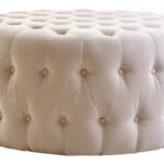 LUCRA Beige Velvet Footstool – round beige velvet footstool with button tufting and foam padding.