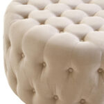 LUCRA Beige Velvet Footstool – round beige velvet footstool with button tufting and foam padding.