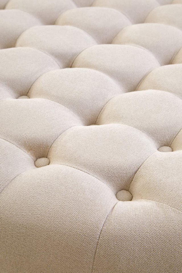 LUCRA Beige Velvet Footstool – round beige velvet footstool with button tufting and foam padding.