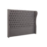 ANTON Super Kingsize Grey Headboard upholstered in grey fabric with deep button tufting, tall wingback sides, and a mid-century modern silhouette.