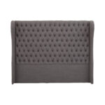 ANTON Super Kingsize Grey Headboard upholstered in grey fabric with deep button tufting, tall wingback sides, and a mid-century modern silhouette.
