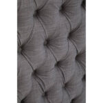 ANTON Super Kingsize Grey Headboard upholstered in grey fabric with deep button tufting, tall wingback sides, and a mid-century modern silhouette.