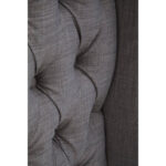 ANTON Super Kingsize Grey Headboard upholstered in grey fabric with deep button tufting, tall wingback sides, and a mid-century modern silhouette.