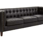 Alt text: VURO Three Seat Black Leather Sofa in antique ebony leather with button tufted back, Chesterfield-inspired three-seat sofa with oak wood legs, elegant black leather sofa for modern and classic interiors.