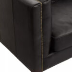 Alt text: VURO Three Seat Black Leather Sofa in antique ebony leather with button tufted back, Chesterfield-inspired three-seat sofa with oak wood legs, elegant black leather sofa for modern and classic interiors.