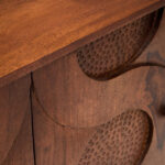 OLIVÉ Mangowood Sideboard – four-door carved mango wood sideboard with hammered details and interlocking motif.