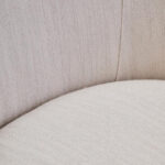 SAVRO Ivory Linen Chair – curved chair upholstered in ivory linen with plush cushioning.