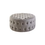 LUCRA Grey Velvet Footstool – round grey velvet footstool with button tufting and foam padding.