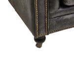 Alt text: IBERIA Three Seat Ebony Leather Sofa in Chesterfield design with deep button tufting, rolled arms, and ebony leather upholstery, classic three-seat sofa with vintage castor feet.