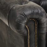 Alt text: IBERIA Three Seat Ebony Leather Sofa in Chesterfield design with deep button tufting, rolled arms, and ebony leather upholstery, classic three-seat sofa with vintage castor feet.