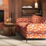 RAY Coffee Table with round oak veneer top and geometric stainless steel base – modern luxury furniture for living rooms.