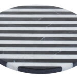 SOMA Small Black and White Marble Round Cheese Board featuring striped black and white marble design displayed with cheese and charcuterie.