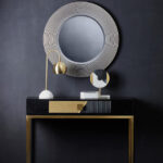 DERVIO Grey Ribbed Round Wall Mirror with contemporary textured grey frame hanging in a modern living room interior.