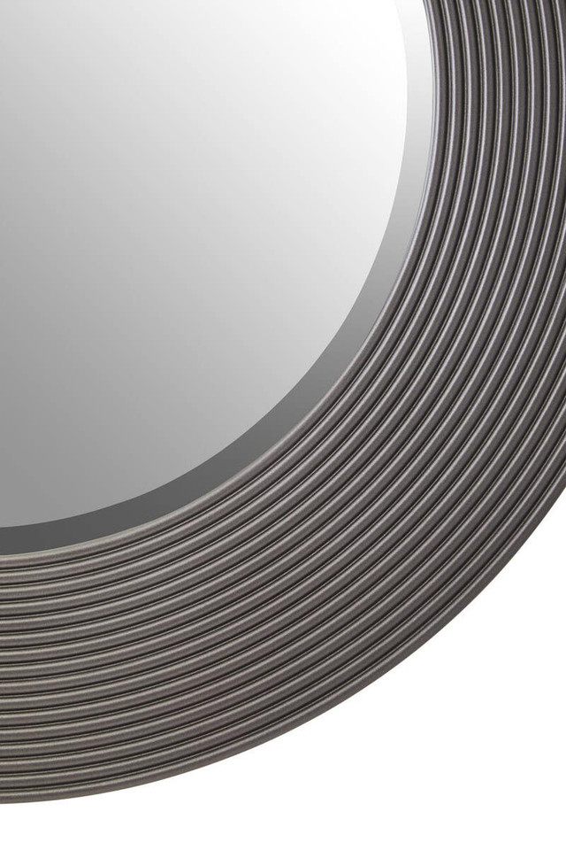 DERVIO Grey Ribbed Round Wall Mirror with contemporary textured grey frame hanging in a modern living room interior.