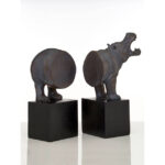 NORIA Set of 2 Hippo Bookends in bronze finish on black bases displayed on a modern bookshelf.