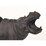 NORIA Set of 2 Hippo Bookends in bronze finish on black bases displayed on a modern bookshelf.