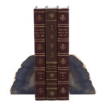 LUVIA Agate Grey and Gold Bookends featuring natural agate texture with gold edges displayed on a modern bookshelf.