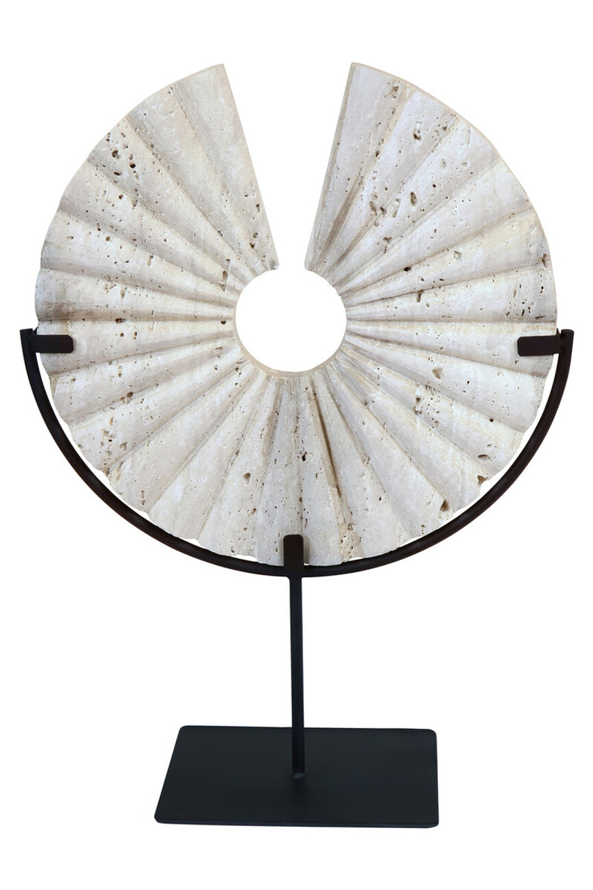 TIBOR Travertine Disc Sculpture featuring a hand-carved circular travertine stone on a sleek black metal base, displayed in a modern living room.