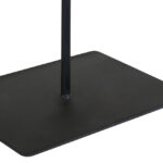 TIBOR Travertine Disc Sculpture featuring a hand-carved circular travertine stone on a sleek black metal base, displayed in a modern living room.