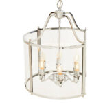 HAMPSTEAD 6 Bulb Chrome Pendant Light featuring clear glass panels and chrome frame suspended above a modern dining table.