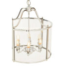 HAMPSTEAD 6 Bulb Chrome Pendant Light featuring clear glass panels and chrome frame suspended above a modern dining table.