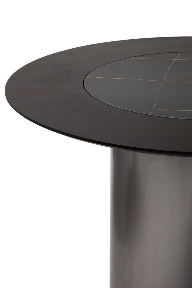 HUGO Round Veneer and Ceramic Dining Table with black marble-effect lazy susan and grey brushed stainless steel base displayed in a modern dining room.