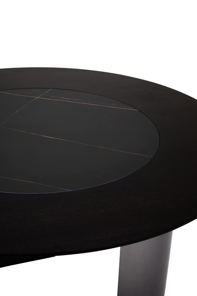 HUGO Round Veneer and Ceramic Dining Table with black marble-effect lazy susan and grey brushed stainless steel base displayed in a modern dining room.