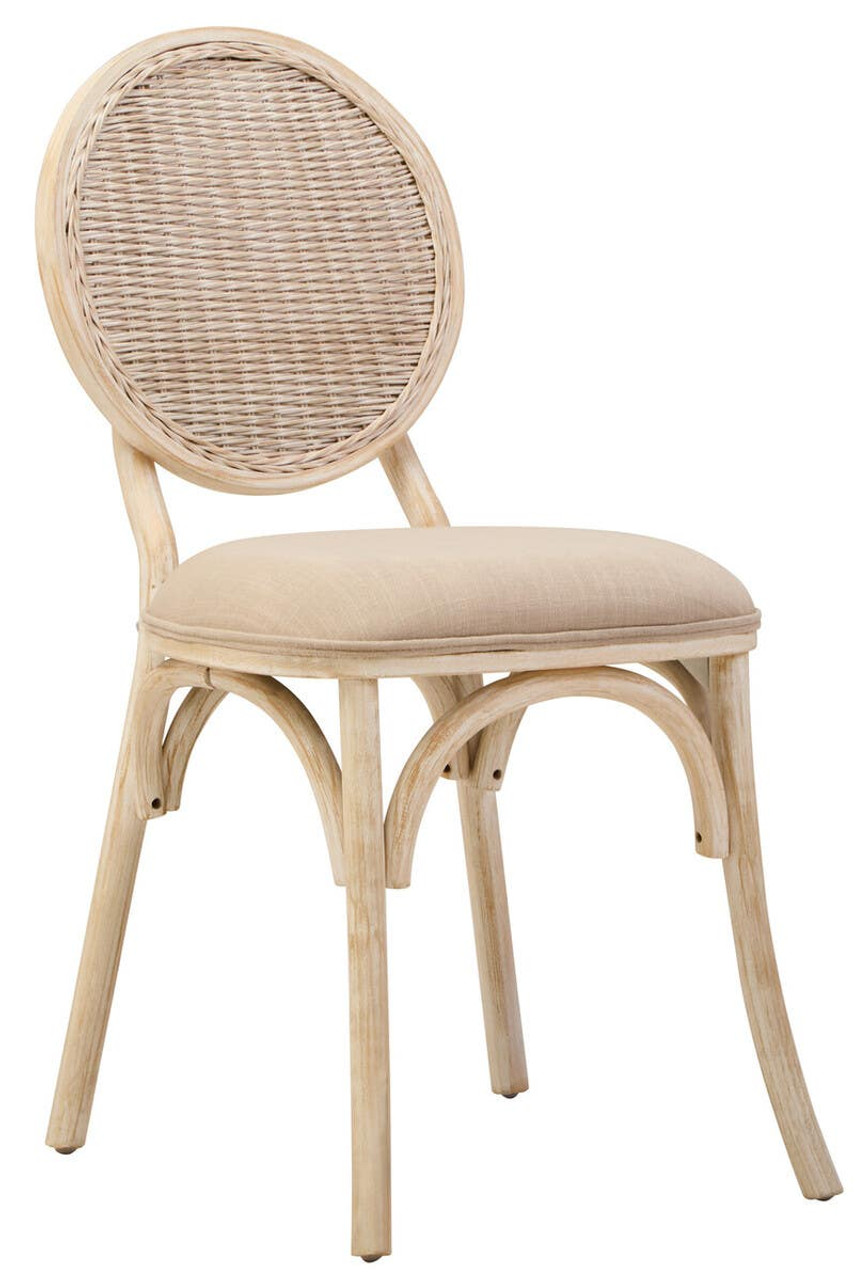 WALTON White Wash Elm Wood Dining Chair featuring cane woven backrest and beige cushioned seat styled in a bright modern dining room.