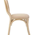WALTON White Wash Elm Wood Dining Chair featuring cane woven backrest and beige cushioned seat styled in a bright modern dining room.