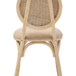 WALTON White Wash Elm Wood Dining Chair featuring cane woven backrest and beige cushioned seat styled in a bright modern dining room.