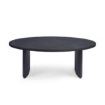 AUSTIN Oval Dining Table in black-brown oak with sculptural end legs and elegant oval top in a modern dining room setting.